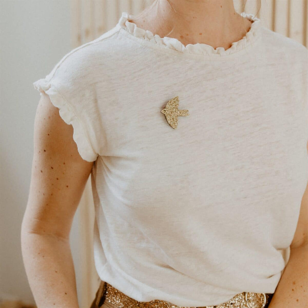 Broche oiseau doré